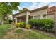 Well-maintained backyard with lush greenery and covered patio at 8537 Glenmount Dr, Las Vegas, NV 89134