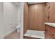 Bathroom featuring wood-look tile, new toilet, and walk-in shower at 8537 Glenmount Dr, Las Vegas, NV 89134