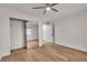 Bright bedroom with mirrored closet doors and ceiling fan at 8537 Glenmount Dr, Las Vegas, NV 89134