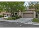 Beautiful single-Gathering home with well-kept landscaping, a spacious driveway, and an attached two-car garage at 8537 Glenmount Dr, Las Vegas, NV 89134
