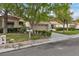Street view of a well-manicured front yard and a two-car garage with a large driveway at 8537 Glenmount Dr, Las Vegas, NV 89134