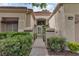 Inviting front entrance with a stone walkway, secure gate, and well-maintained landscaping at 8537 Glenmount Dr, Las Vegas, NV 89134