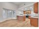 Sun-filled kitchen area with breakfast bar, wood cabinets, and updated appliances, perfect for casual dining at 8537 Glenmount Dr, Las Vegas, NV 89134