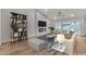 Vaulted living room showcases modern decor, fireplace, backyard access, and abundant natural light at 8537 Glenmount Dr, Las Vegas, NV 89134
