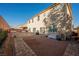Spacious backyard boasting a brick-lined layout, offering ample space for relaxation, outdoor dining, and entertainment at 8543 Alpine Vineyards Ct, Las Vegas, NV 89139