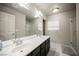 Bathroom features double sinks, large mirror, and separate walk-in shower at 8543 Alpine Vineyards Ct, Las Vegas, NV 89139