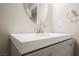 Close-up of the bathroom featuring a modern vanity with gray cabinets and white countertop at 8543 Alpine Vineyards Ct, Las Vegas, NV 89139