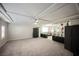 Bright bonus room features plush carpeting, recessed lighting, and plenty of space for activities at 8543 Alpine Vineyards Ct, Las Vegas, NV 89139