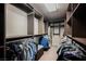 Walk-in closet boasts custom shelving and ample storage space for clothes and accessories at 8543 Alpine Vineyards Ct, Las Vegas, NV 89139