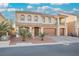 Inviting home boasting a three-car garage, front yard landscaping, and a lovely covered balcony at 8543 Alpine Vineyards Ct, Las Vegas, NV 89139