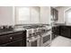 Kitchen stainless steel oven and granite countertops, with abundant natural light at 8543 Alpine Vineyards Ct, Las Vegas, NV 89139