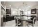 Stylish kitchen with an island, stainless steel appliances, and dark wood cabinets at 8543 Alpine Vineyards Ct, Las Vegas, NV 89139