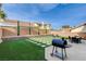 Spacious backyard featuring manicured grass, a patio, and a barbecue grill at 8636 Caribbean Ct, Las Vegas, NV 89117