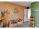 room with play area, toy storage, and leafy green wall decor at 8636 Caribbean Ct, Las Vegas, NV 89117