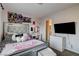 Cozy bedroom featuring modern decor, a well-lit vanity, and ample natural light at 8636 Caribbean Ct, Las Vegas, NV 89117