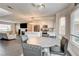 Open concept dining area connected to the living room and modern kitchen at 8636 Caribbean Ct, Las Vegas, NV 89117