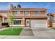Charming two-story home featuring a well-manicured lawn and a classic tile roof at 8636 Caribbean Ct, Las Vegas, NV 89117