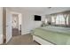 Spacious bedroom with a large bed and access to a walk-in closet at 8636 Caribbean Ct, Las Vegas, NV 89117
