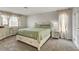 Bedroom features a neutral color scheme, large bed, and dual windows at 8636 Caribbean Ct, Las Vegas, NV 89117