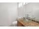 Powder room features granite counters, modern faucet, vessel sink and neutral colors at 91 Bowler Springs St, Las Vegas, NV 89148