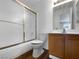 Bathroom features a vanity, an enclosed shower with glass doors, a toilet, and wood flooring at 913 Boulder Springs Dr # 202, Las Vegas, NV 89128