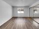 Comfortable bedroom with a mirrored closet and window at 913 Boulder Springs Dr # 202, Las Vegas, NV 89128