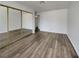 Spacious bedroom with a mirrored closet and wood-look floors at 913 Boulder Springs Dr # 202, Las Vegas, NV 89128