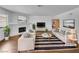 Bright, staged living room featuring a cozy fireplace, modern furnishings, and neutral color palette at 913 Boulder Springs Dr # 202, Las Vegas, NV 89128