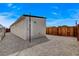 Exterior view of the back of the house, a fenced yard, and gravel ground cover at 974 Balzar Ave, Las Vegas, NV 89106