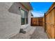 View of the backyard from the home, featuring gravel ground and wooden fencing at 974 Balzar Ave, Las Vegas, NV 89106