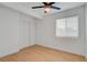 Inviting bedroom with wood-look flooring, a large window, and closet space at 974 Balzar Ave, Las Vegas, NV 89106