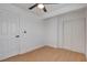 Well-lit bedroom featuring wood-look floors, closet, and modern ceiling fan at 974 Balzar Ave, Las Vegas, NV 89106