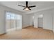 Bright bedroom with a ceiling fan, closet, and sliding glass door to the outside at 974 Balzar Ave, Las Vegas, NV 89106