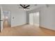 Bright bedroom featuring a ceiling fan and sliding glass door that leads to a private outdoor space at 974 Balzar Ave, Las Vegas, NV 89106