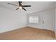 Bright, airy bedroom with wood floors and a door leading to the outside at 974 Balzar Ave, Las Vegas, NV 89106