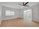 Bright, airy bedroom with wood floors and a door leading to the outside at 974 Balzar Ave, Las Vegas, NV 89106