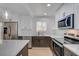 Bright kitchen with stainless steel appliances and a center island with seating at 974 Balzar Ave, Las Vegas, NV 89106