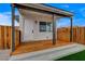 Covered porch with fresh paint, natural wood floors and gravel landscaping at 974 Balzar Ave, Las Vegas, NV 89106