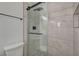 Close-up of a modern bathroom shower featuring sleek hardware and elegant tiling at 974 Balzar Ave, Las Vegas, NV 89106