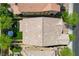 Aerial view of the house showcasing the tile roof, backyard with turf, and outdoor seating area at 9921 Rams Leap Ave, Las Vegas, NV 89166