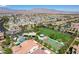 An aerial view of the community park, basketball court, and single Gathering homes at 9921 Rams Leap Ave, Las Vegas, NV 89166