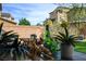 Inviting backyard patio features a dining table set among plants, perfect for outdoor enjoyment and entertaining at 9921 Rams Leap Ave, Las Vegas, NV 89166