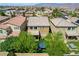 Rear view of the house showcasing well-maintained yard with patio, turf, seating, and an outdoor spa at 9921 Rams Leap Ave, Las Vegas, NV 89166