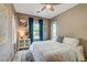Cozy bedroom with lots of light, light wood floors and decorative accents at 9921 Rams Leap Ave, Las Vegas, NV 89166