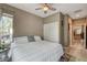 Bedroom featuring neutral walls, light wood flooring, and a ceiling fan at 9921 Rams Leap Ave, Las Vegas, NV 89166