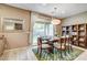 Cozy dining area with sliding glass doors to the backyard and stylish decor at 9921 Rams Leap Ave, Las Vegas, NV 89166