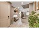 Inviting entryway with wood-look floors, tasteful decor, and a view into the living area at 9921 Rams Leap Ave, Las Vegas, NV 89166