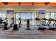Gym featuring treadmills, elliptical machines, weights, and large windows with neighborhood views at 9921 Rams Leap Ave, Las Vegas, NV 89166