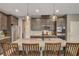 Modern kitchen boasts stainless steel appliances, granite countertops, and stylish pendant lighting at 9921 Rams Leap Ave, Las Vegas, NV 89166