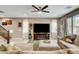 Bright living room with large TV, comfortable seating, and stylish decor accents at 9921 Rams Leap Ave, Las Vegas, NV 89166